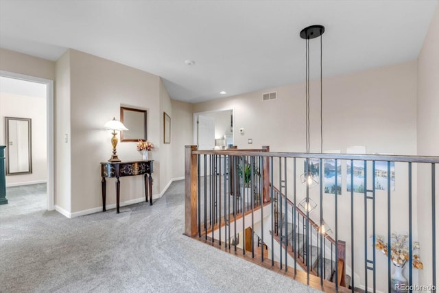 6266 Holman St, Arvada, CO 80004 - hallway featuring an upstairs landing, carpet floors, and baseboards