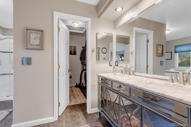 6266 Holman St, Arvada, CO 80004 - full bath featuring double vanity, a shower stall, baseboards, tile patterned flooring, and a walk in closet