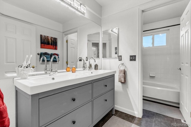 6266 Holman St, Arvada, CO 80004 - bathroom with double vanity, baseboards, tile patterned flooring, and washtub / shower combination