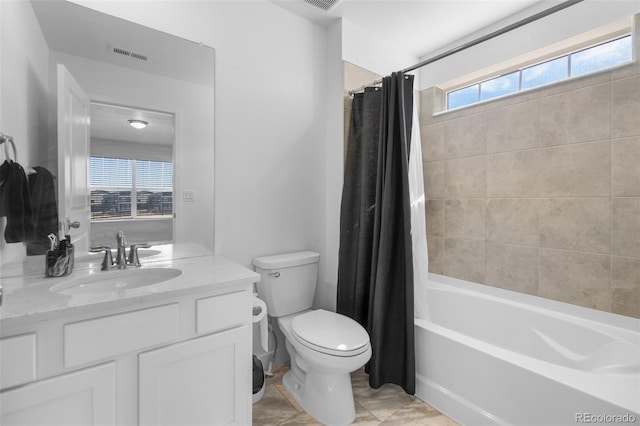 bathroom with vanity, toilet, shower / bath combo, and visible vents