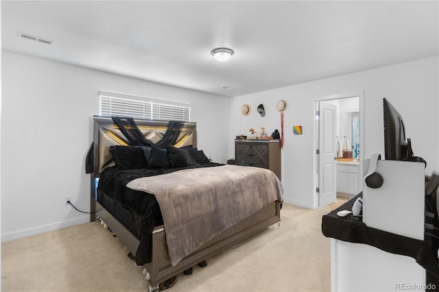 bedroom featuring visible vents, light colored carpet, and baseboards