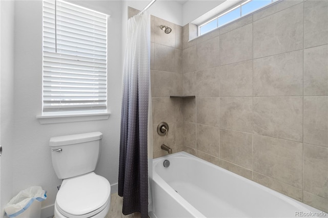 full bath featuring shower / bathtub combination with curtain and toilet