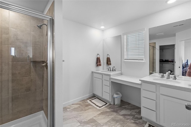 bathroom featuring visible vents, vanity, marble finish floor, and a shower stall