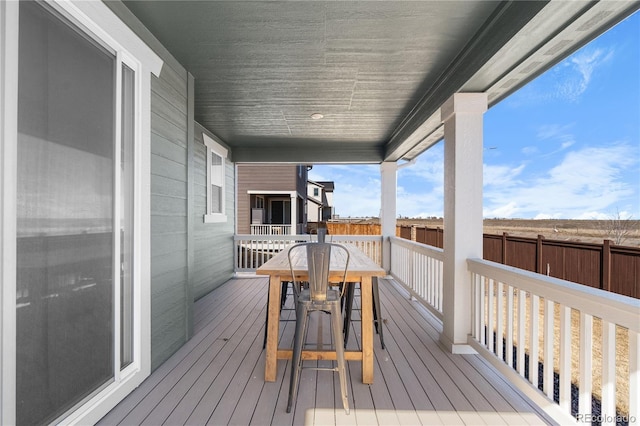 wooden terrace with outdoor dining area