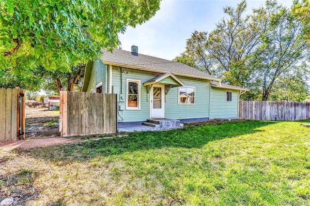 view of front of home with a front yard