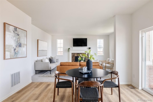 dining space featuring light wood-type flooring