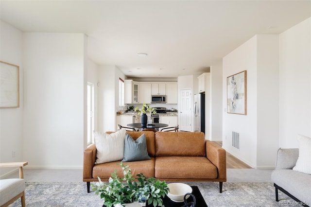 living room with light colored carpet