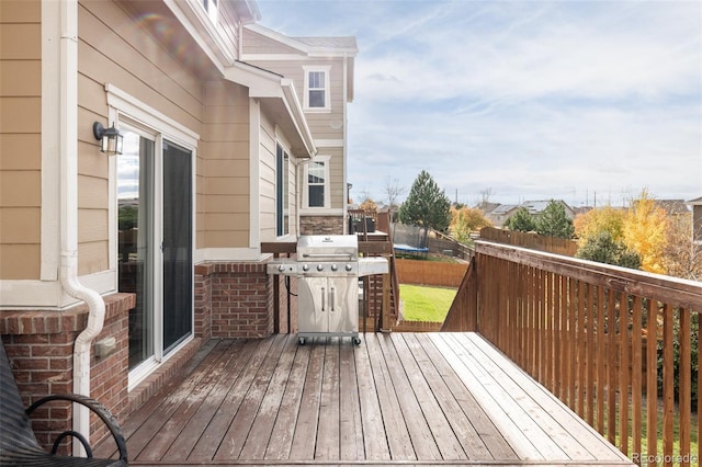 wooden deck featuring grilling area