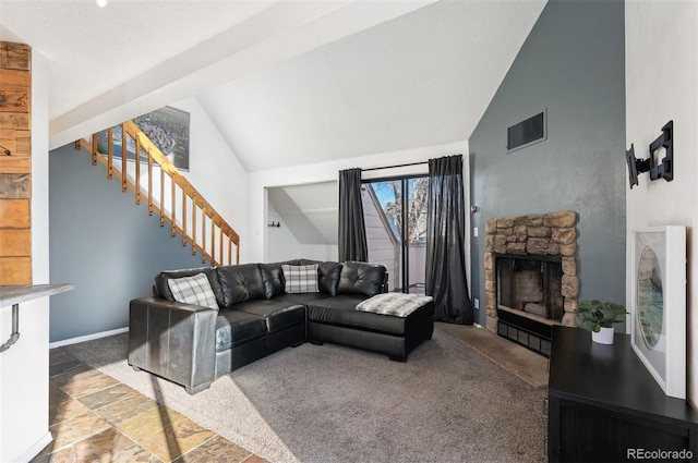 living room featuring a stone fireplace, carpet flooring, and lofted ceiling