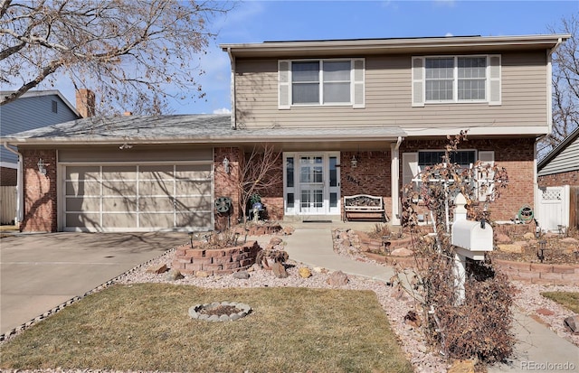 view of front facade featuring a garage, concrete driveway, and brick siding