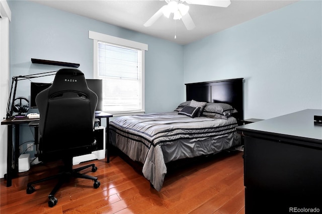 bedroom featuring a ceiling fan and wood finished floors