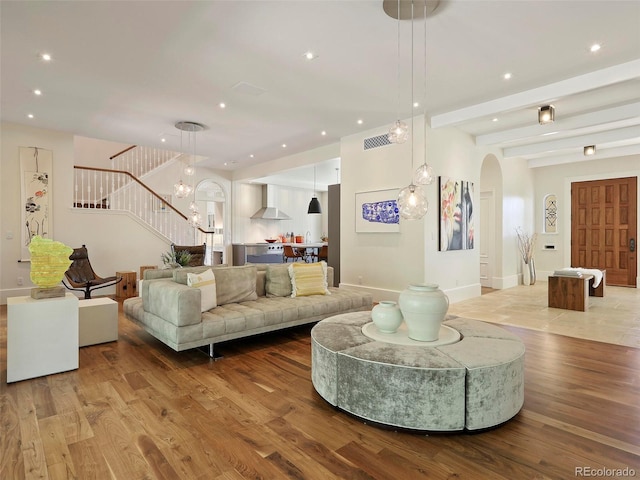 living room featuring hardwood / wood-style flooring and a chandelier