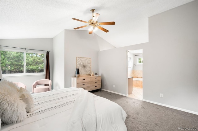 8288 W Chestnut Ave, Littleton, CO 80128 - carpeted bedroom with vaulted ceiling, ensuite bath, and ceiling fan