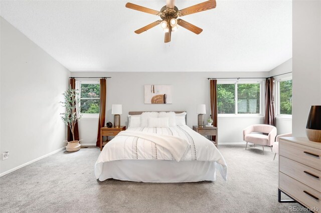 8288 W Chestnut Ave, Littleton, CO 80128 - bedroom with vaulted ceiling, light carpet, and ceiling fan