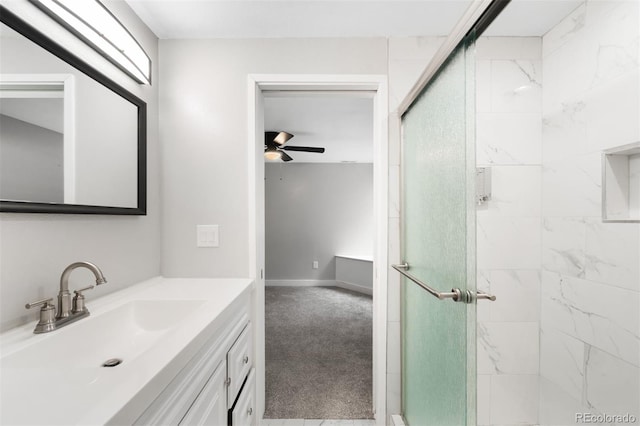 8288 W Chestnut Ave, Littleton, CO 80128 - bathroom featuring a stall shower, vanity, and a ceiling fan