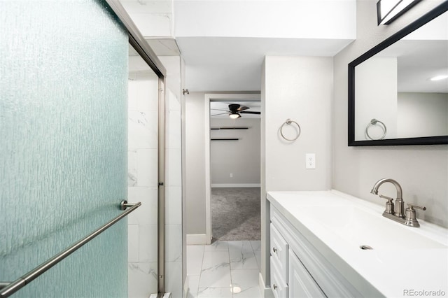 8288 W Chestnut Ave, Littleton, CO 80128 - bathroom featuring marble finish floors, vanity, a ceiling fan, and a stall shower