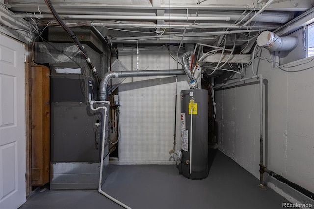 utility room featuring gas water heater and heating unit