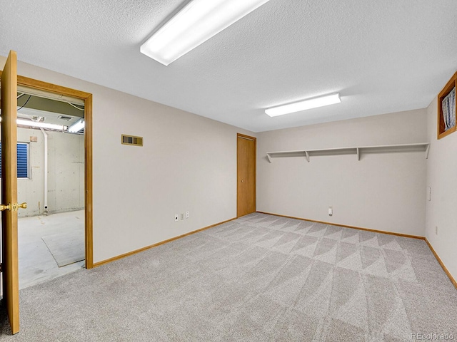 7391 S Knolls Way, Centennial, CO 80122 - finished basement with light carpet and a textured ceiling