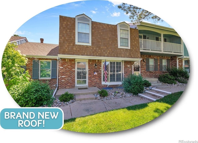 7391 S Knolls Way, Centennial, CO 80122 - view of front of property with brick siding and a shingled roof