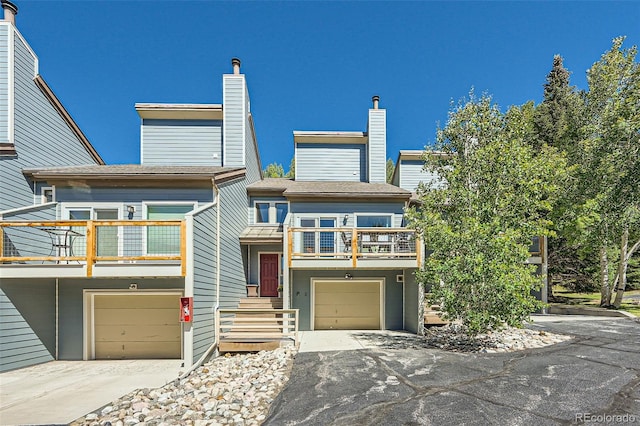 view of front of house featuring a balcony and a garage