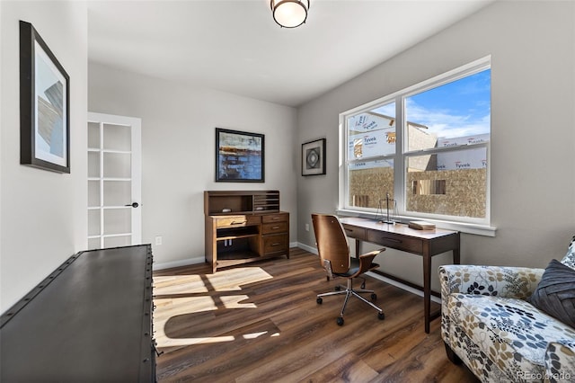 office area with baseboards and dark wood finished floors