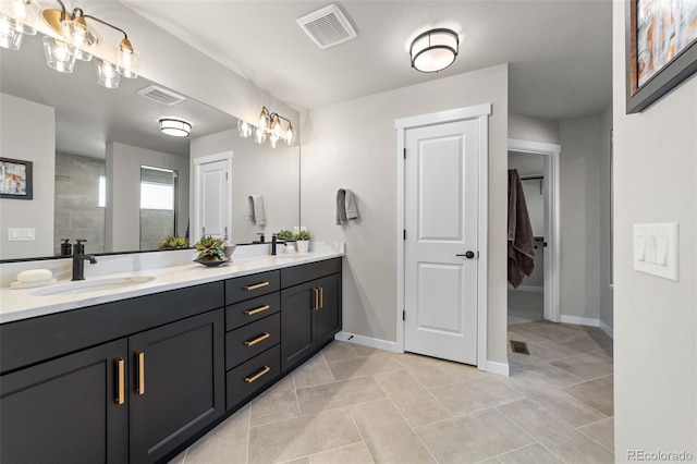 full bath with double vanity, visible vents, baseboards, and a sink