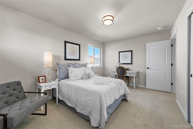 bedroom featuring baseboards and light carpet