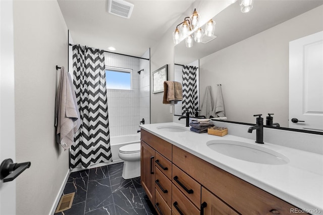 bathroom featuring a sink, visible vents, marble finish floor, and double vanity