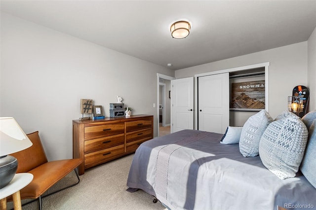 bedroom featuring a closet and light colored carpet