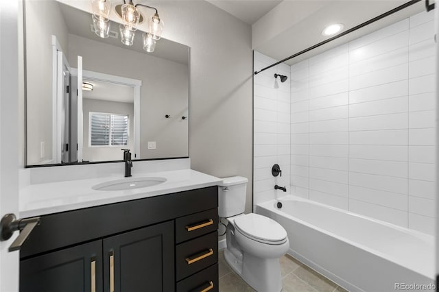 full bathroom featuring tile patterned floors, tub / shower combination, toilet, and vanity