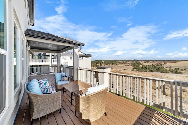 wooden terrace featuring outdoor lounge area