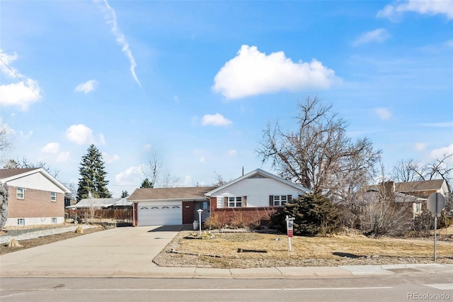 ranch-style home with a garage and concrete driveway