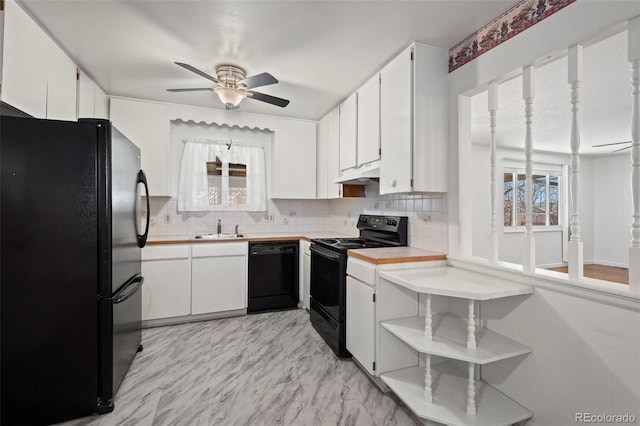 343 Melody Dr, Northglenn, CO 80260 - kitchen with a ceiling fan, plenty of natural light, black appliances, under cabinet range hood, and decorative backsplash