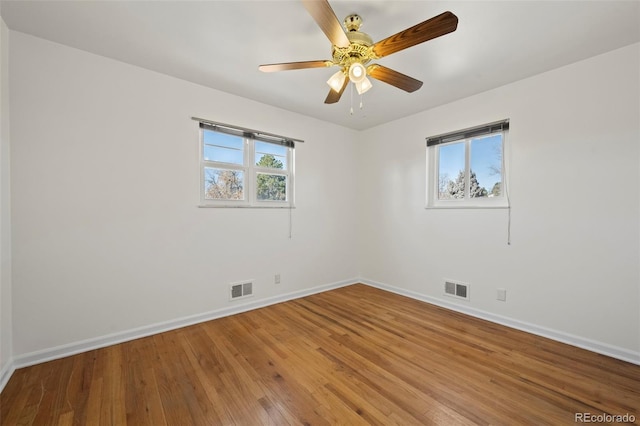 343 Melody Dr, Northglenn, CO 80260 - spare room with baseboards, a ceiling fan, visible vents, and wood finished floors