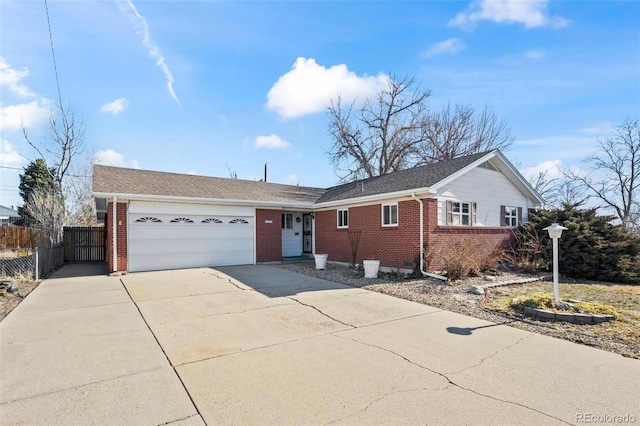 343 Melody Dr, Northglenn, CO 80260 - single story home featuring fence, concrete driveway, an attached garage, and brick siding