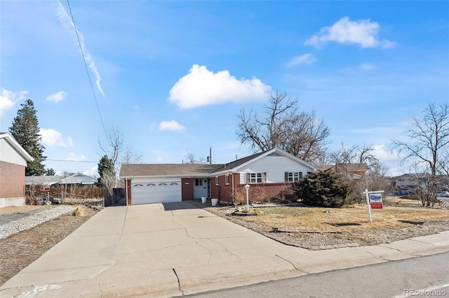 343 Melody Dr, Northglenn, CO 80260 - ranch-style house featuring driveway, brick siding, a garage, and fence