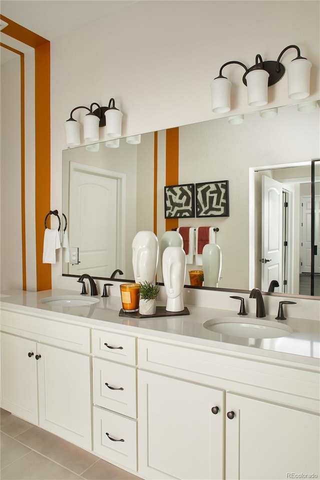 full bath featuring tile patterned flooring and double vanity