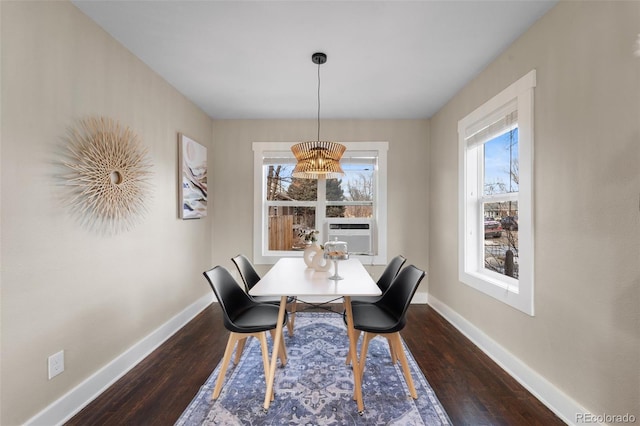 dining space with cooling unit and dark hardwood / wood-style flooring