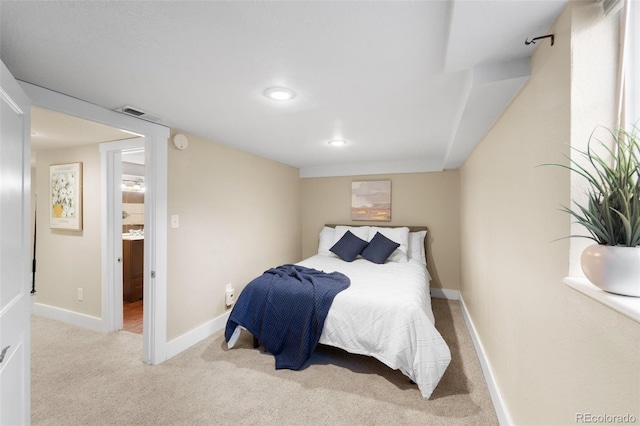 bedroom featuring light colored carpet