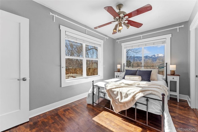 bedroom featuring dark wood-type flooring and ceiling fan