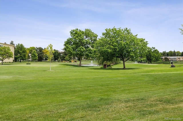 650 S Alton Way Unit 10A, Denver, CO 80247 - view of home's community featuring a yard, view of golf course, and view of wooded area