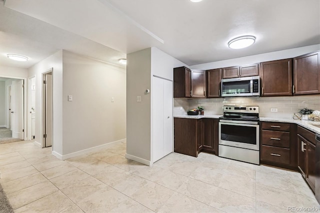 650 S Alton Way Unit 10A, Denver, CO 80247 - kitchen with appliances with stainless steel finishes, decorative backsplash, dark brown cabinets, and light tile patterned floors