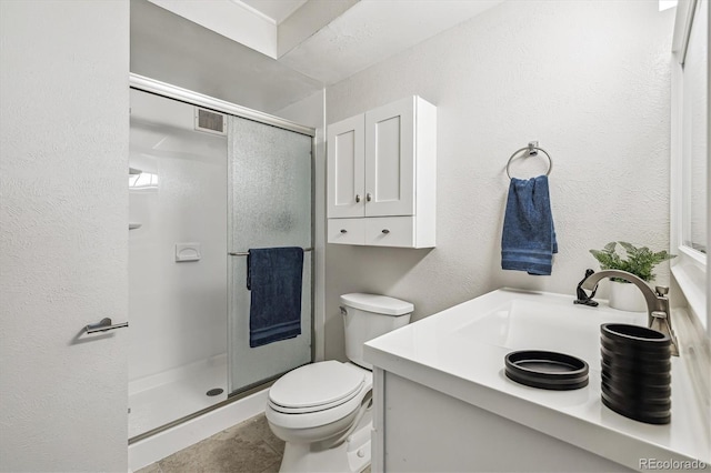 650 S Alton Way Unit 10A, Denver, CO 80247 - full bath with a shower stall, toilet, vanity, a textured wall, and tile patterned flooring