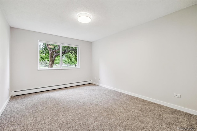 650 S Alton Way Unit 10A, Denver, CO 80247 - spare room with baseboard heating, carpet, and baseboards