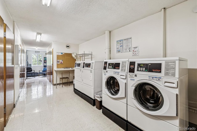 650 S Alton Way Unit 10A, Denver, CO 80247 - community laundry room featuring independent washer and dryer and a textured ceiling