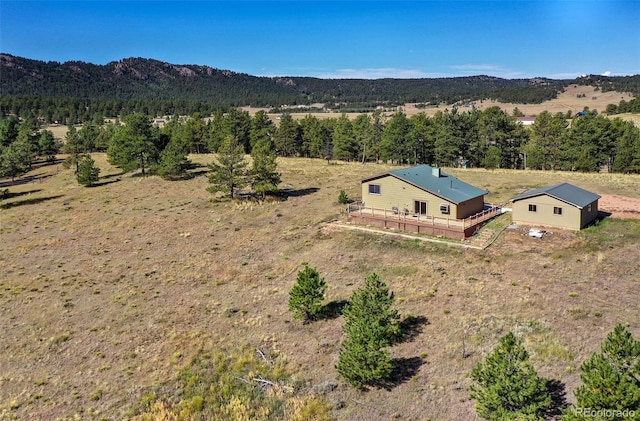 drone / aerial view with a mountain view and a rural view