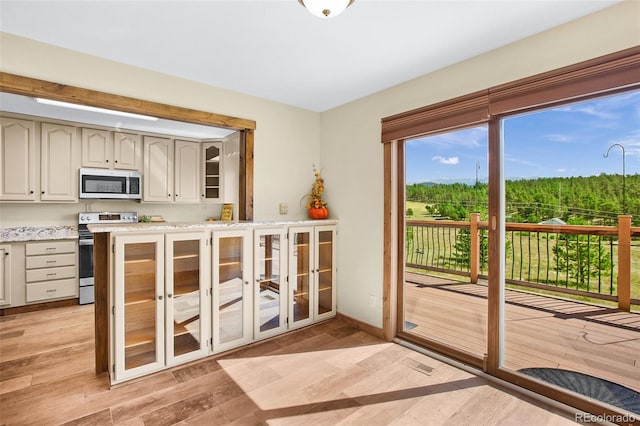 doorway to outside featuring light hardwood / wood-style flooring