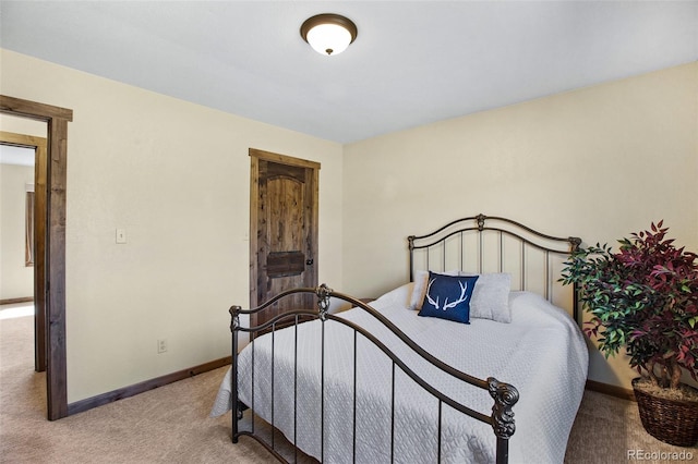 bedroom featuring light colored carpet