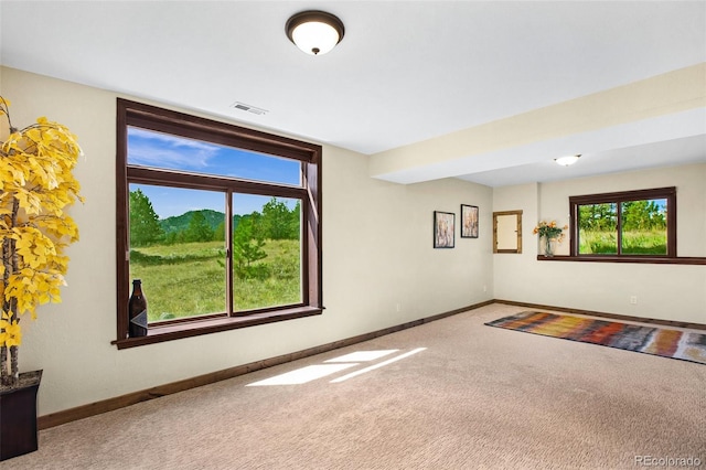 unfurnished living room with carpet flooring