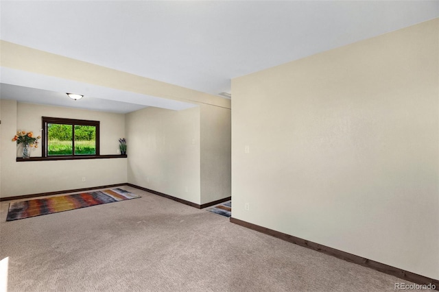 unfurnished room featuring carpet flooring